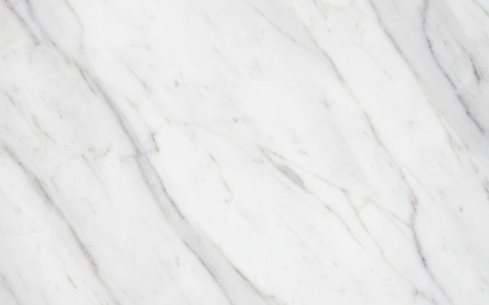 Mandala Supreme marble — polished slab surface showing White coloring. Origin: Brazil. Hardness: 3 Mohs. Acid sensitivity: high.