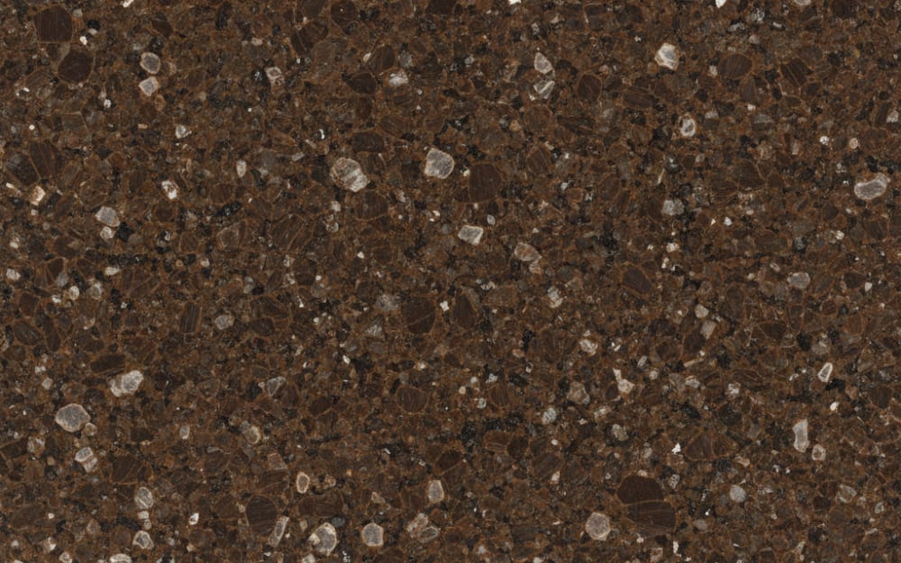 Marron Cohiba granite — polished slab surface showing Brown coloring. Origin: Brazil. Hardness: 6 Mohs. Acid sensitivity: none.