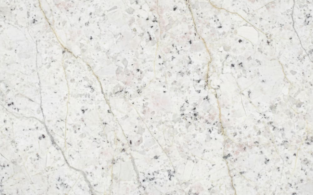 Mirage White granite — polished slab surface showing White coloring. Origin: Brazil. Hardness: 6 Mohs. Acid sensitivity: none.