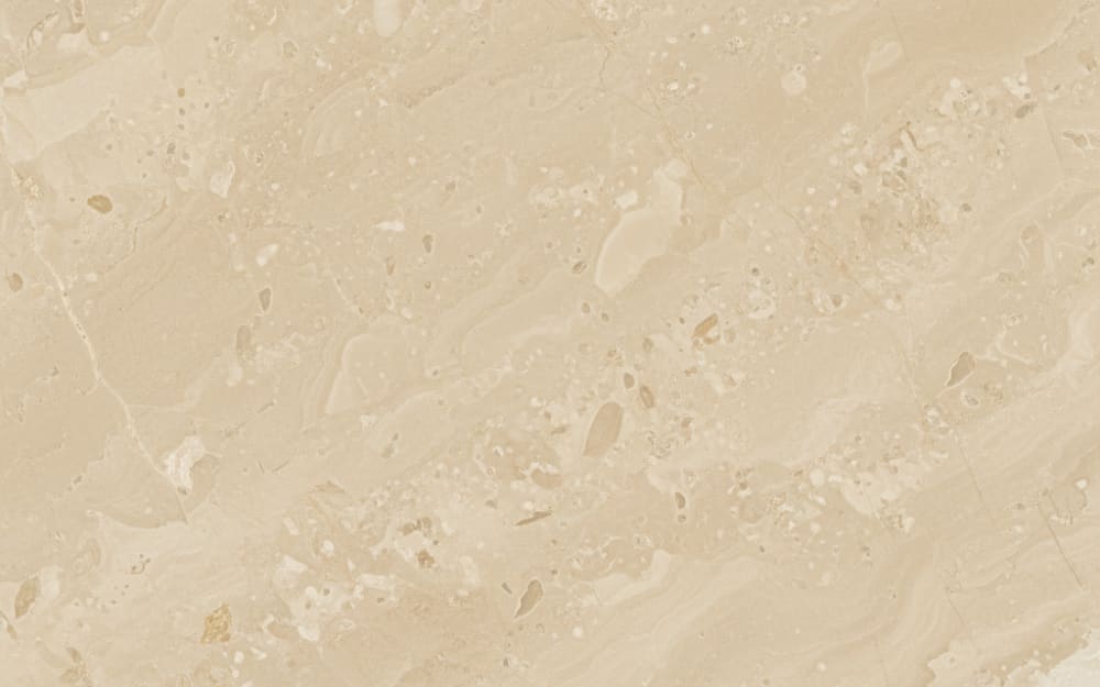 Moca Creme limestone — polished slab surface showing Cream coloring. Origin: Portugal (Ançã, Coimbra district). Hardness: 3 Mohs. Acid sensitivity: high.