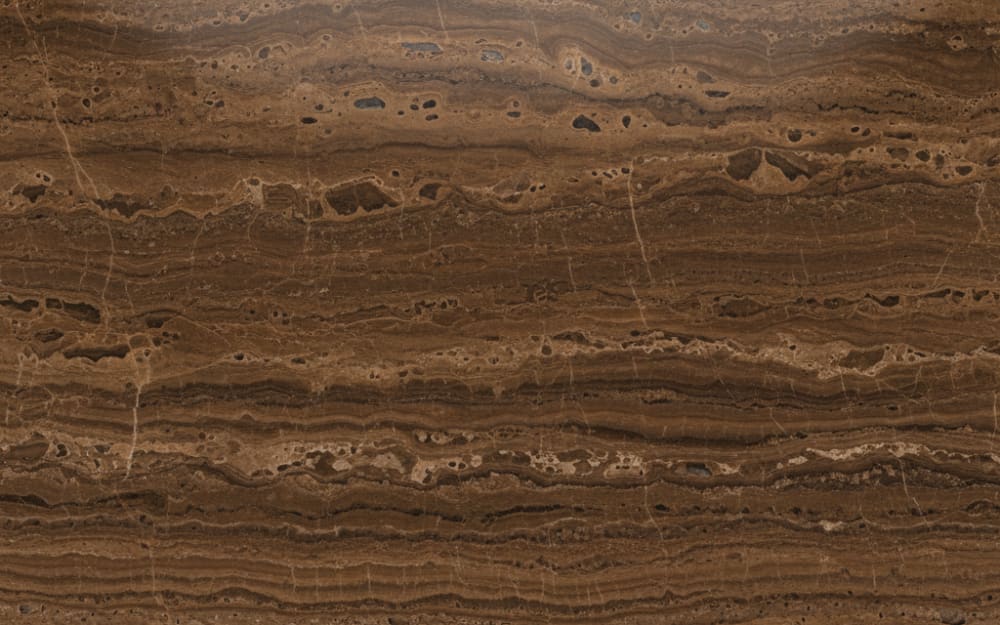Mocha Travertine travertine — polished slab surface showing Brown coloring. Origin: Turkey. Hardness: 4 Mohs. Acid sensitivity: high.