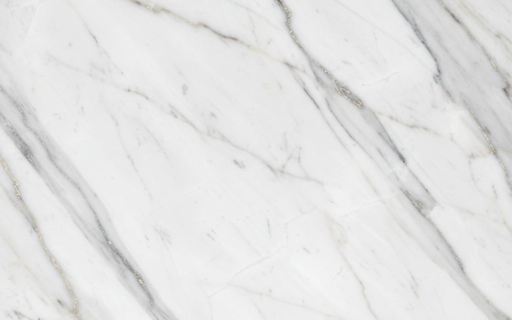 Nestos marble — polished slab surface showing White coloring. Origin: Greece (Drama). Hardness: 3 Mohs. Acid sensitivity: high.