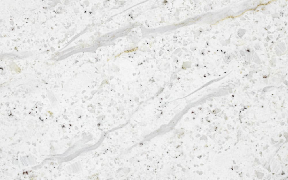 New River White granite — polished slab surface showing White coloring. Origin: Brazil. Hardness: 6 Mohs. Acid sensitivity: none.
