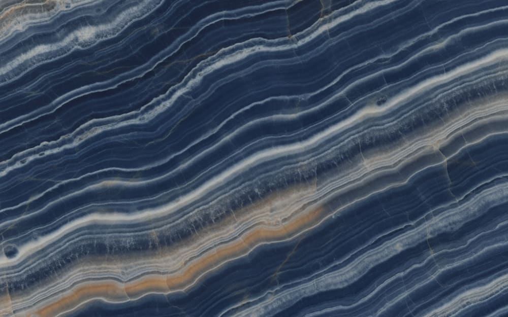 Ocean Blue Onyx onyx — polished slab surface showing Blue coloring. Origin: Brazil / Morocco. Hardness: 3 Mohs. Acid sensitivity: high.