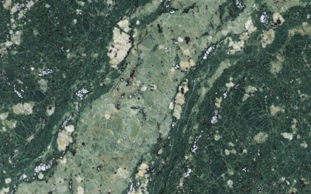Peacock Green granite — polished slab surface showing Green coloring. Origin: India. Hardness: 6 Mohs. Acid sensitivity: none.