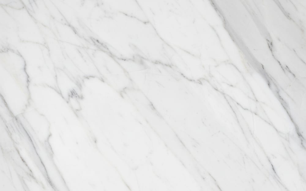 Pirgon Alas marble — polished slab surface showing White coloring. Origin: Greece (Drama). Hardness: 3 Mohs. Acid sensitivity: high.