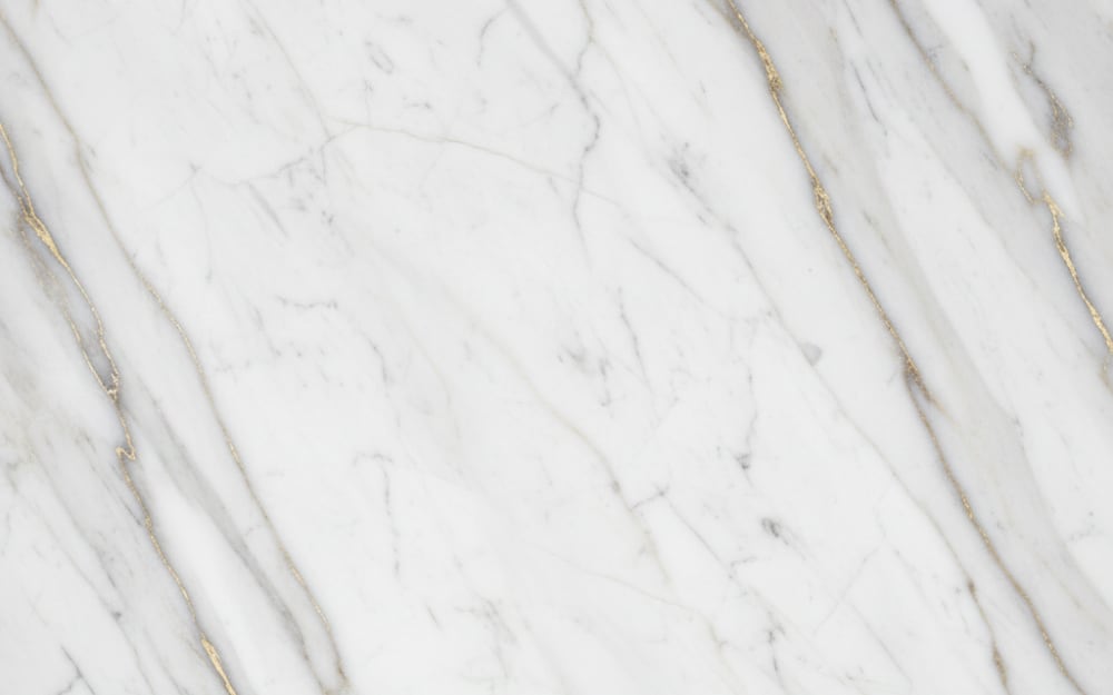 Portinari marble — polished slab surface showing White coloring. Origin: Brazil. Hardness: 3 Mohs. Acid sensitivity: high.