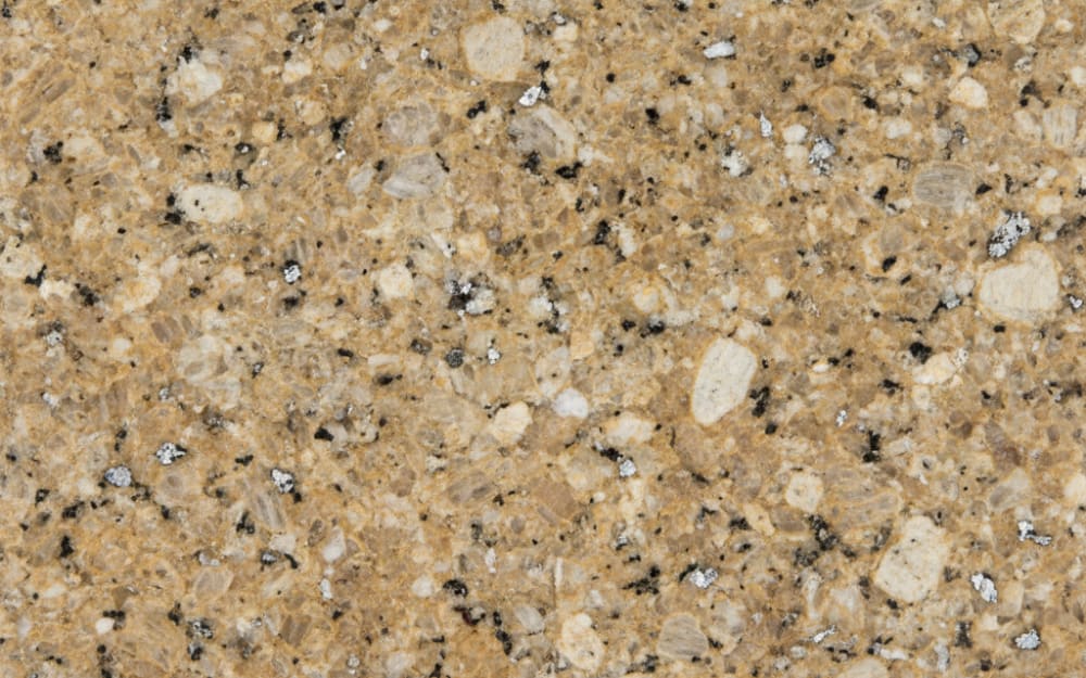 Santa Cecilia granite — polished slab surface showing Tan/Beige coloring. Origin: Brazil (Espirito Santo). Hardness: 6 Mohs. Acid sensitivity: none.