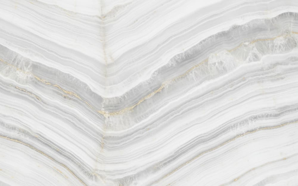 Sea Pearl Quartzite quartzite — polished slab surface showing Grey coloring. Origin: Brazil (Espírito Santo). Hardness: 7 Mohs. Acid sensitivity: none.