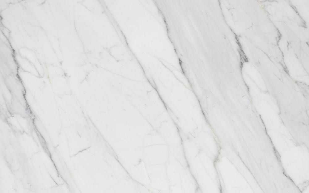 Semi Rijo marble — polished slab surface showing White coloring. Origin: Portugal (Estremoz). Hardness: 3 Mohs. Acid sensitivity: high.