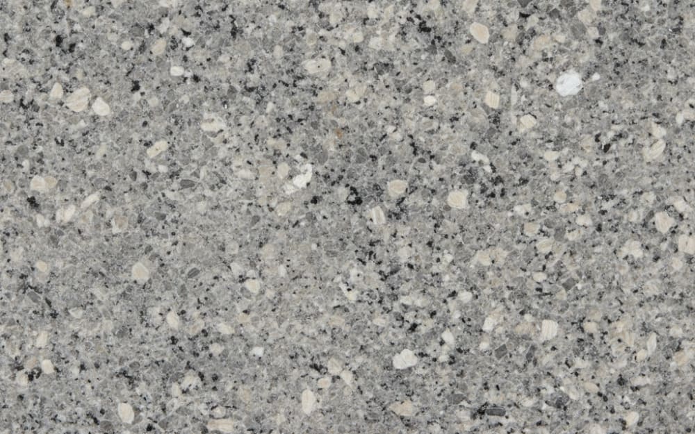 Silver Cloud granite — polished slab surface showing Grey coloring. Origin: India. Hardness: 6 Mohs. Acid sensitivity: none.