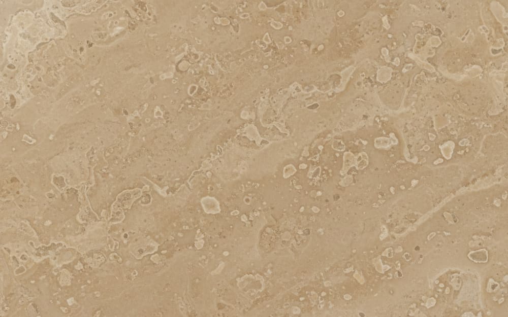 St. Hubert Beige limestone — polished slab surface showing Cream coloring. Origin: Belgium / France. Hardness: 3 Mohs. Acid sensitivity: high.