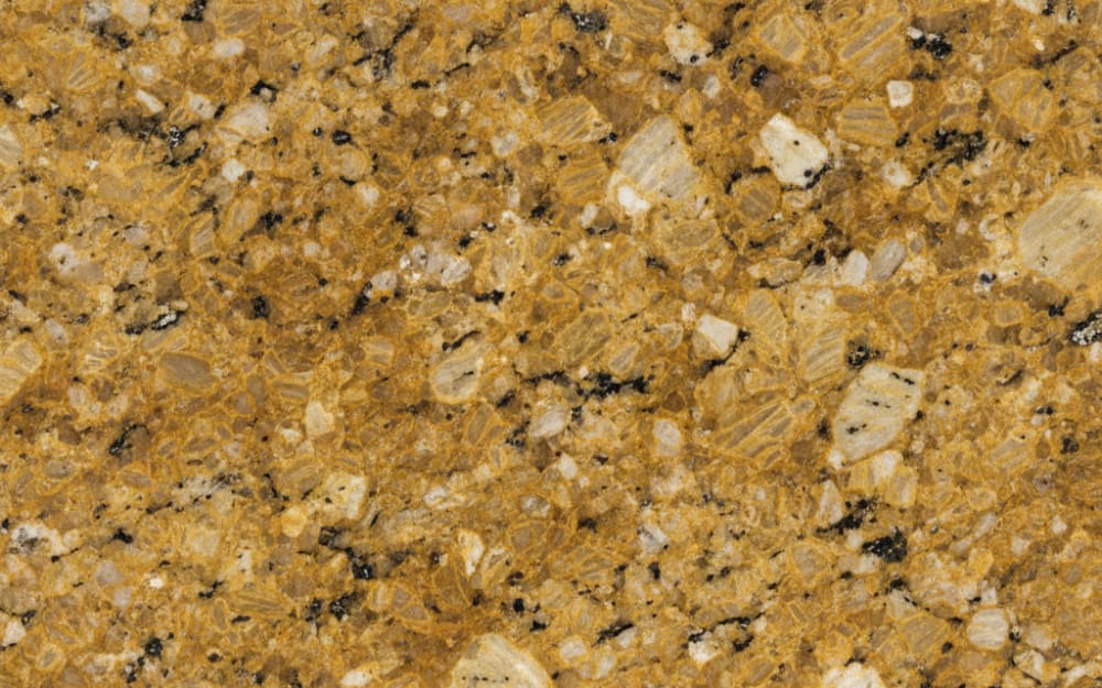 Topazio Imperial granite — polished slab surface showing Grey coloring. Origin: Brazil. Hardness: 6 Mohs. Acid sensitivity: none.