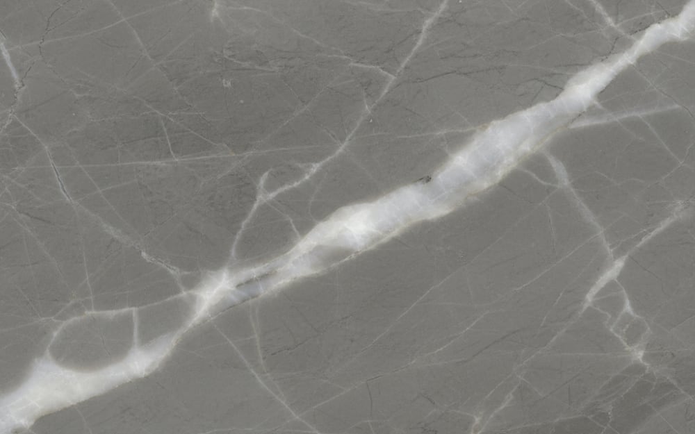 Turkish Silver marble — polished slab surface showing Grey coloring. Origin: Turkey. Hardness: 3 Mohs. Acid sensitivity: high.