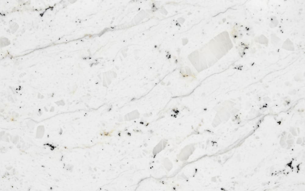 Valley White granite — polished slab surface showing White coloring. Origin: India. Hardness: 6 Mohs. Acid sensitivity: none.