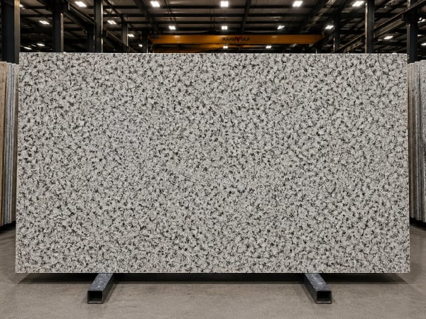 Bianco Taupe granite polished slab surface texture — White tones, quarried from Brazil