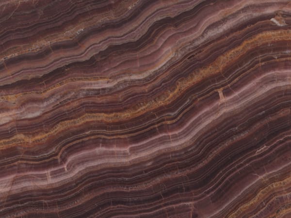 Fire Onyx (Red Onyx) onyx polished slab surface texture — Red/Pink tones, quarried from Iran / Pakistan