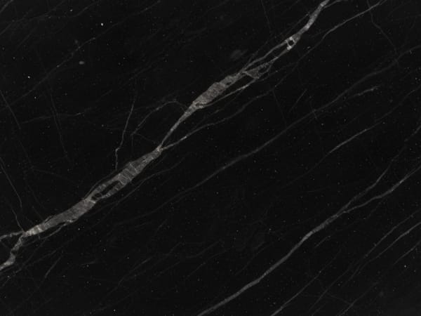 Nero Marquina marble polished slab surface texture — Black tones, quarried from Spain (Markina-Xemein, Basque Country)