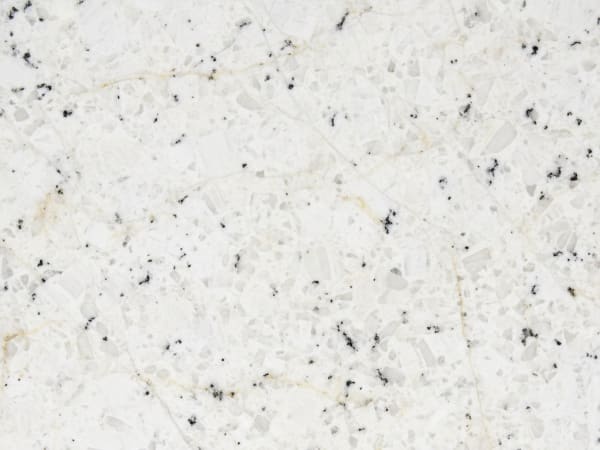 Spokane White granite polished slab surface texture — White tones, quarried from India / Brazil