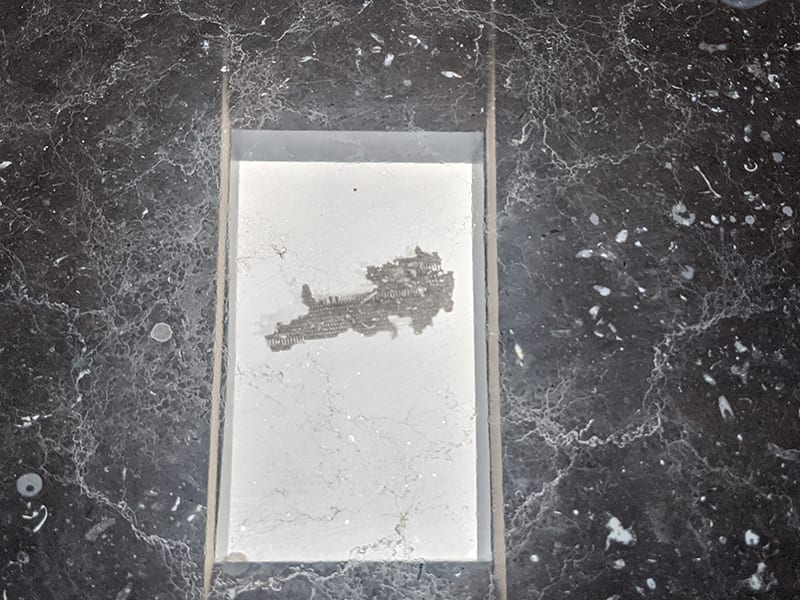 Marble table before MORE® AntiEtch® treatment showing acid etch damage