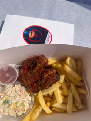 Chicken and chips with coleslaw and ketchup 