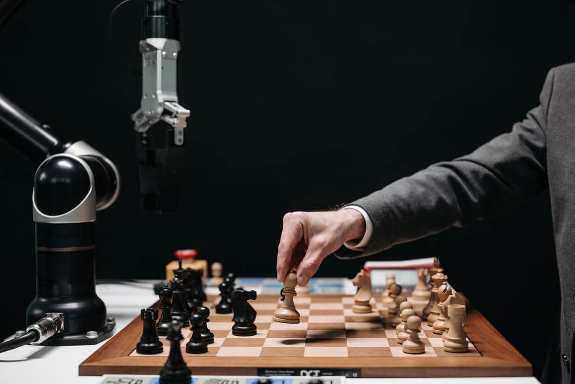 Man playing robot at chess