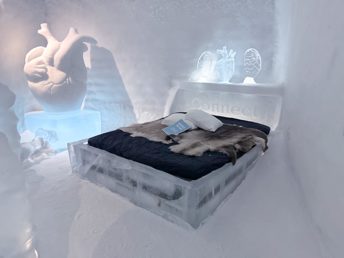 ice hotel ice room bed sleeping bag reindeer hide