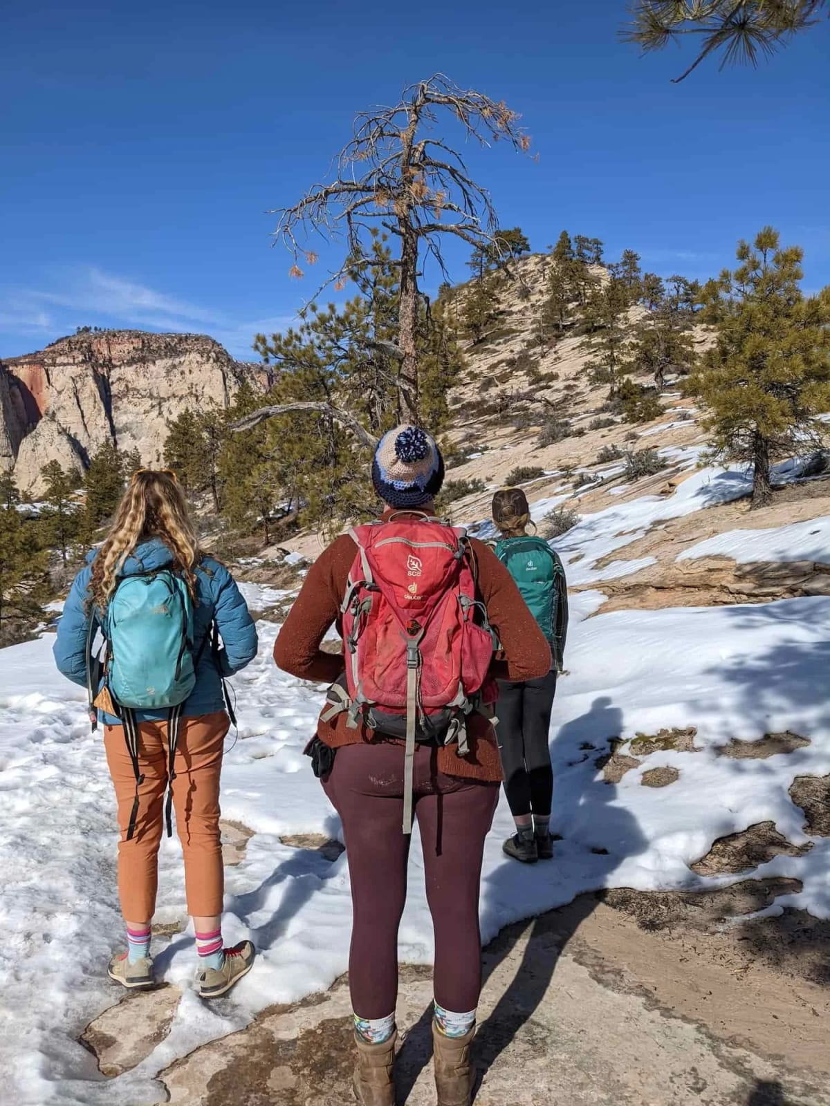 hiking boots winter gear layers backpack