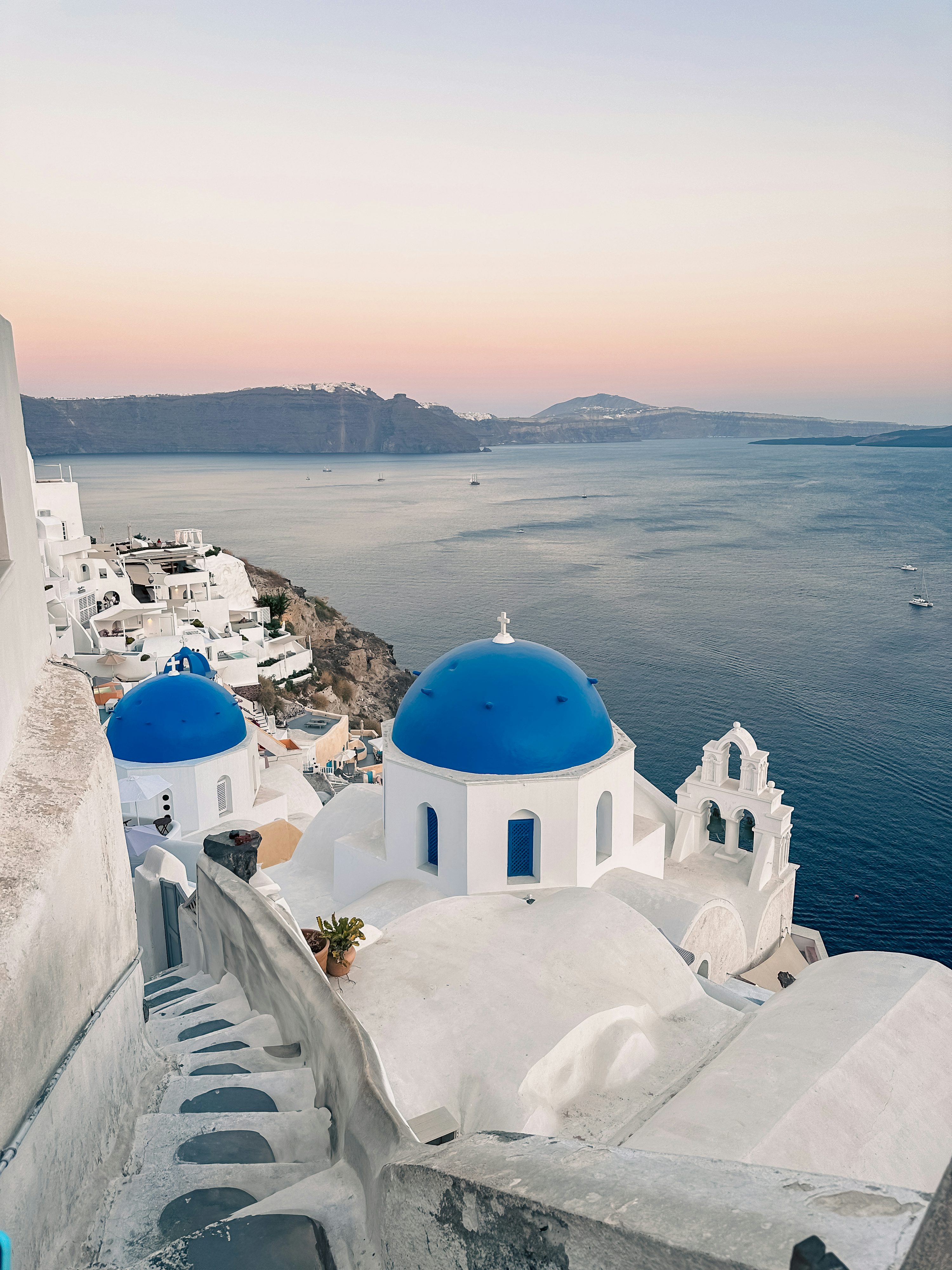 Santorini Greece white blue domed churches cliffs