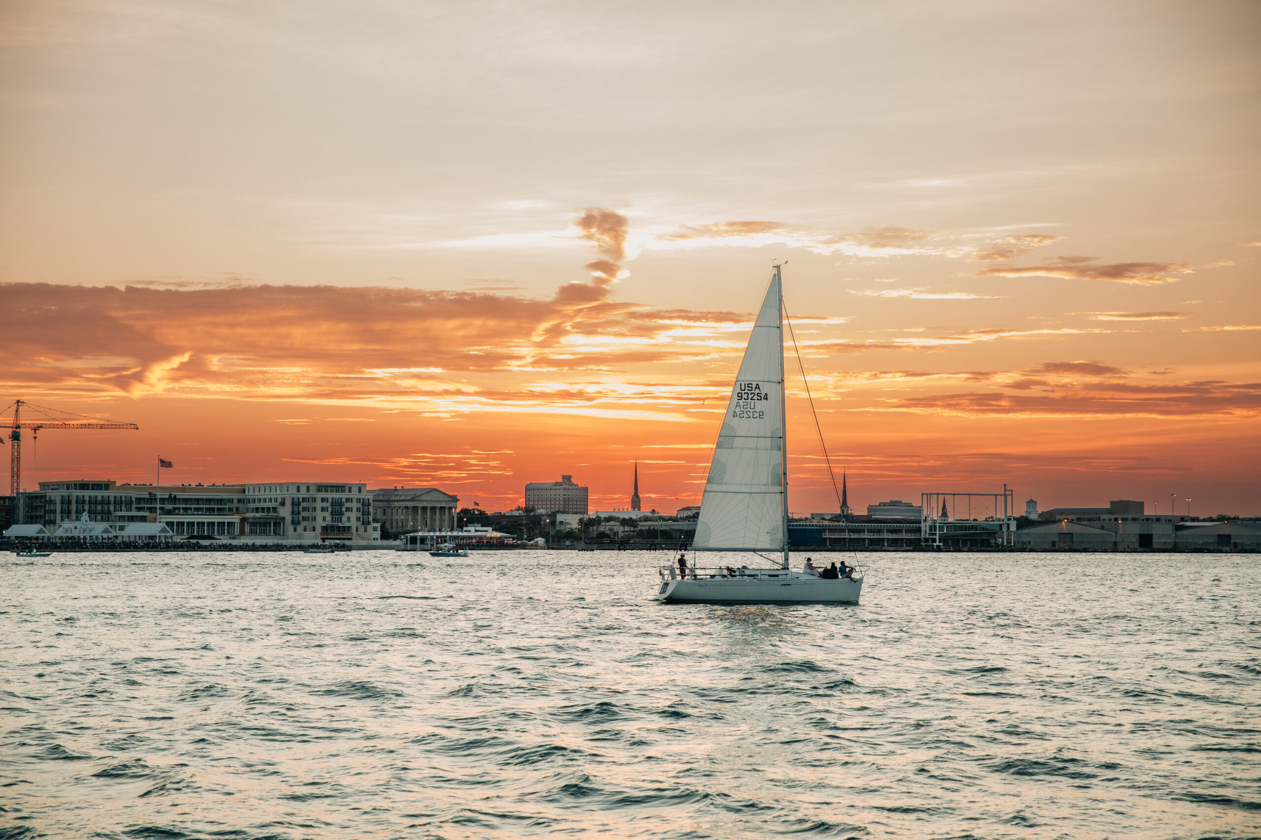 sunset harbor cruise Charleston skyline October golden hour