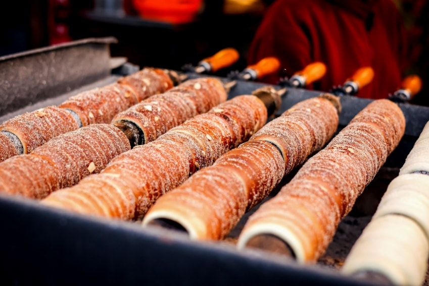 Prague Christmas market grilled sausage trdelnik food stall