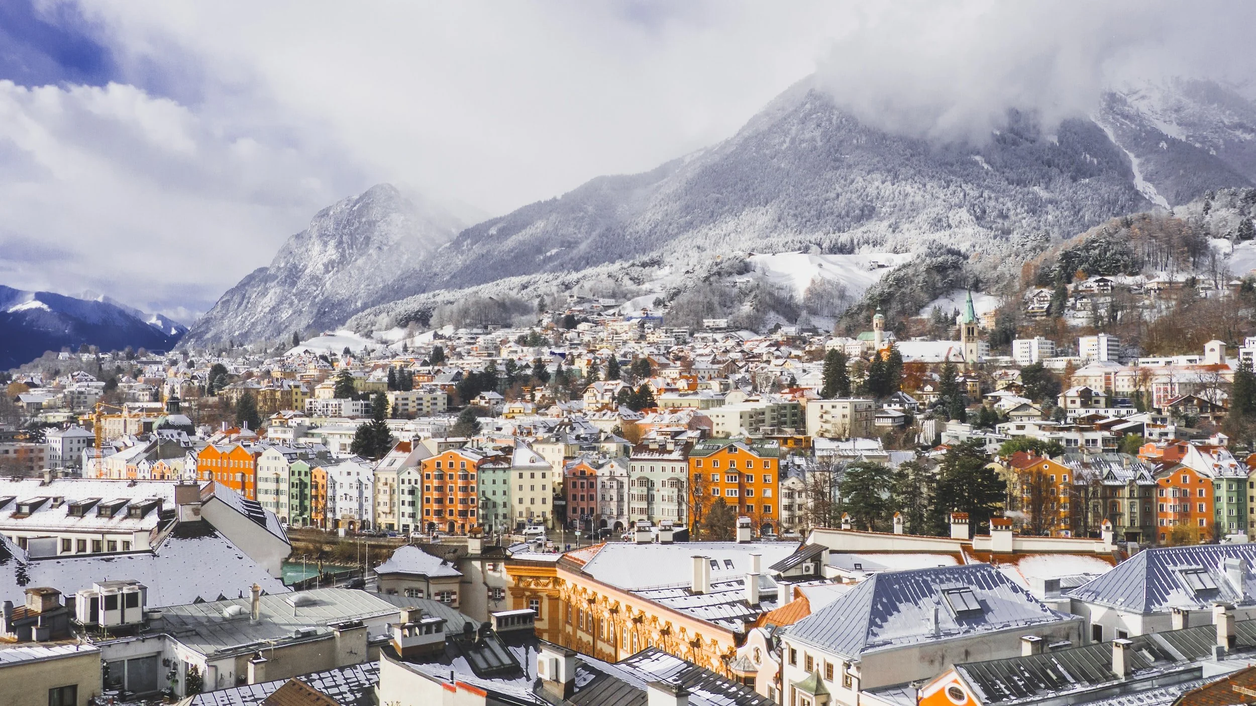 Innsbruck Christmas market snow covered mountains