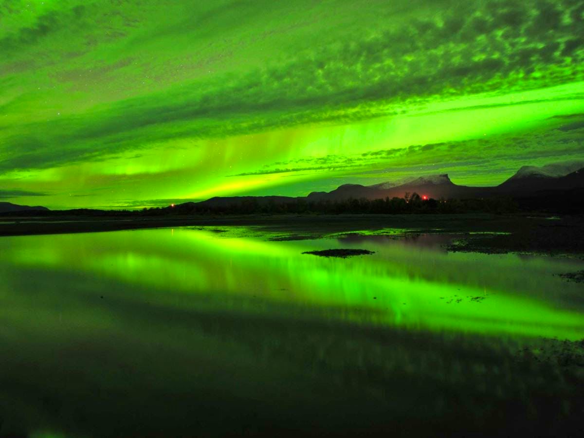 Abisko Sweden northern lights lake reflection