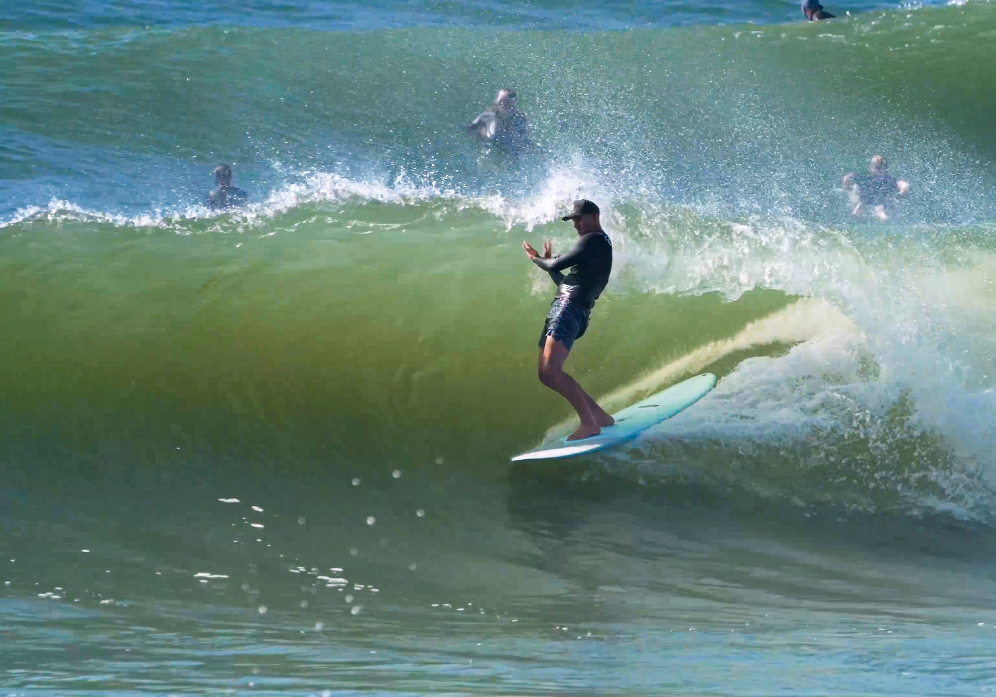 New Smyrna Beach winter waves surfers