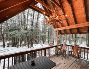 snow covered lakeside cabin fireplace winter