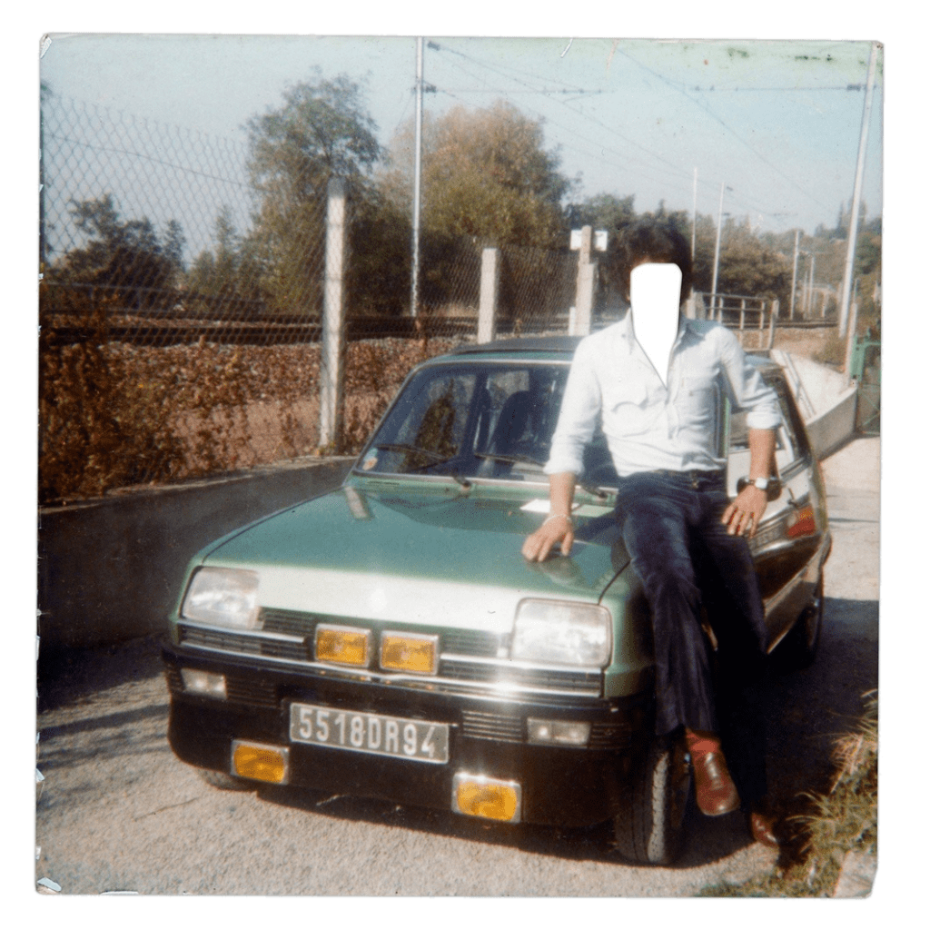 A man leaning on a green car, face blanked out.