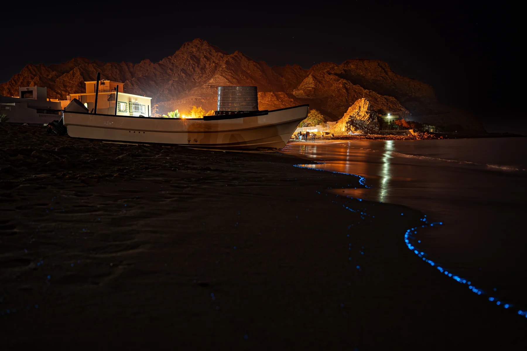 Al Bustan Beach at night with blue lights