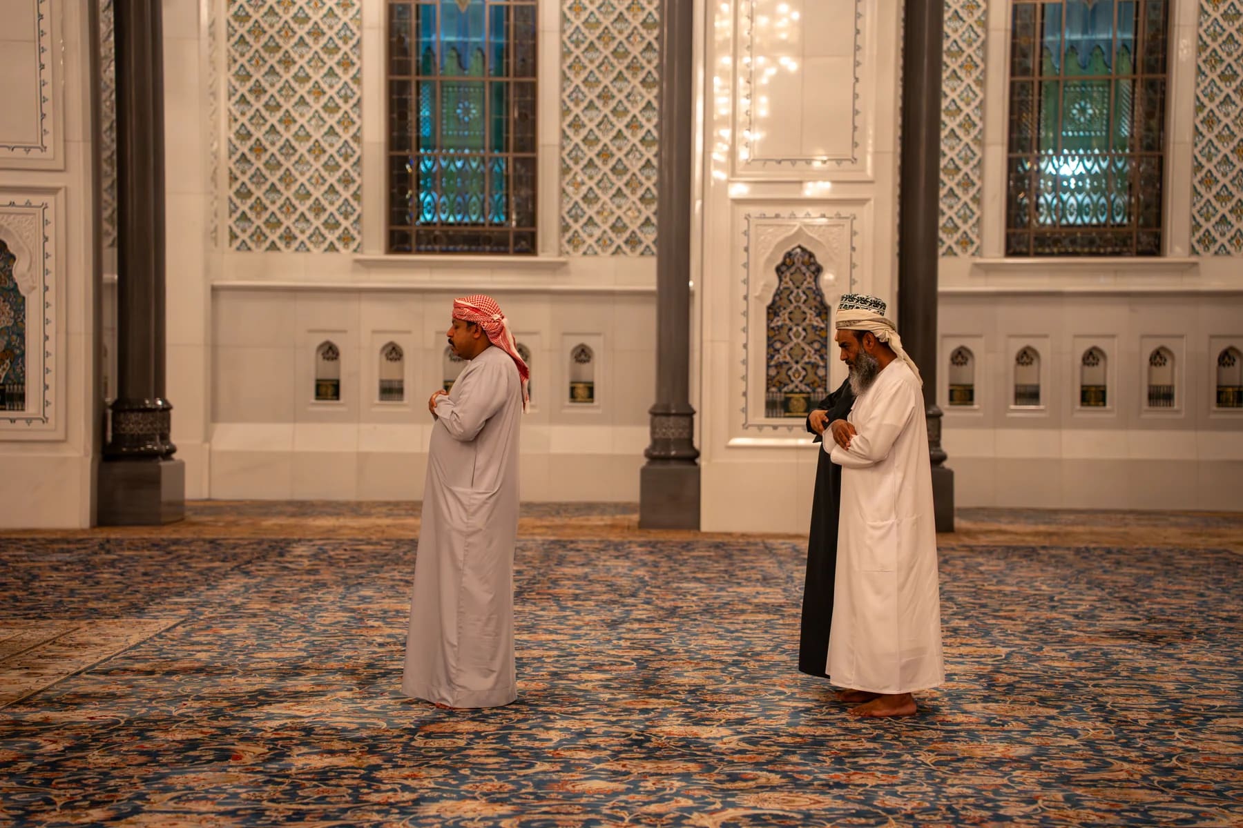 Group of men praying together in the mosque