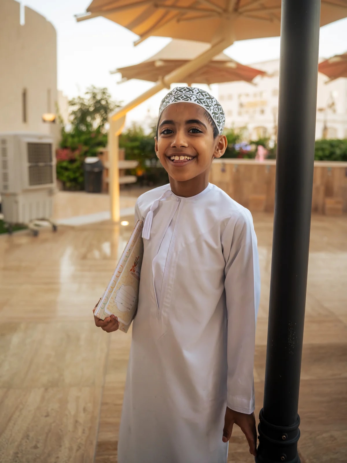 Close-up portrait of a boy near Mutrah Souq mosque