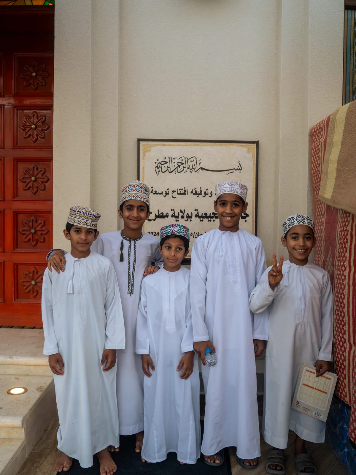 Group of boys near the Mutrah Souq mosque