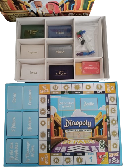 A player holding Dinopoly game cards.