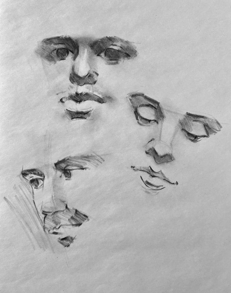 Three portrait sketches in charcoal on white paper
