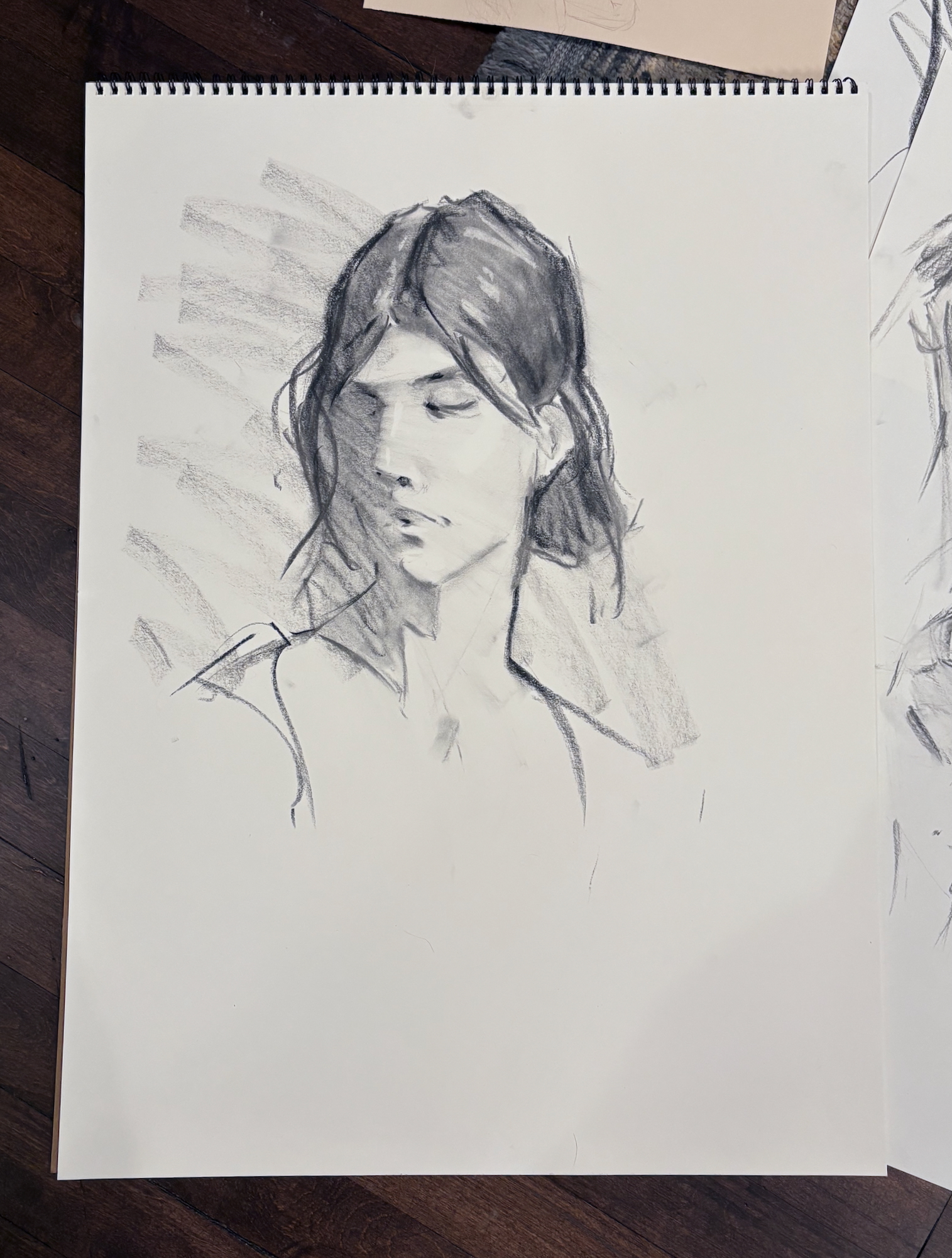 25 minute pose, vine charcoal and charcoal pencil, 18 x 24 in. A few proportion issues. The composition feels a bit promising but kind of awkward on the page.