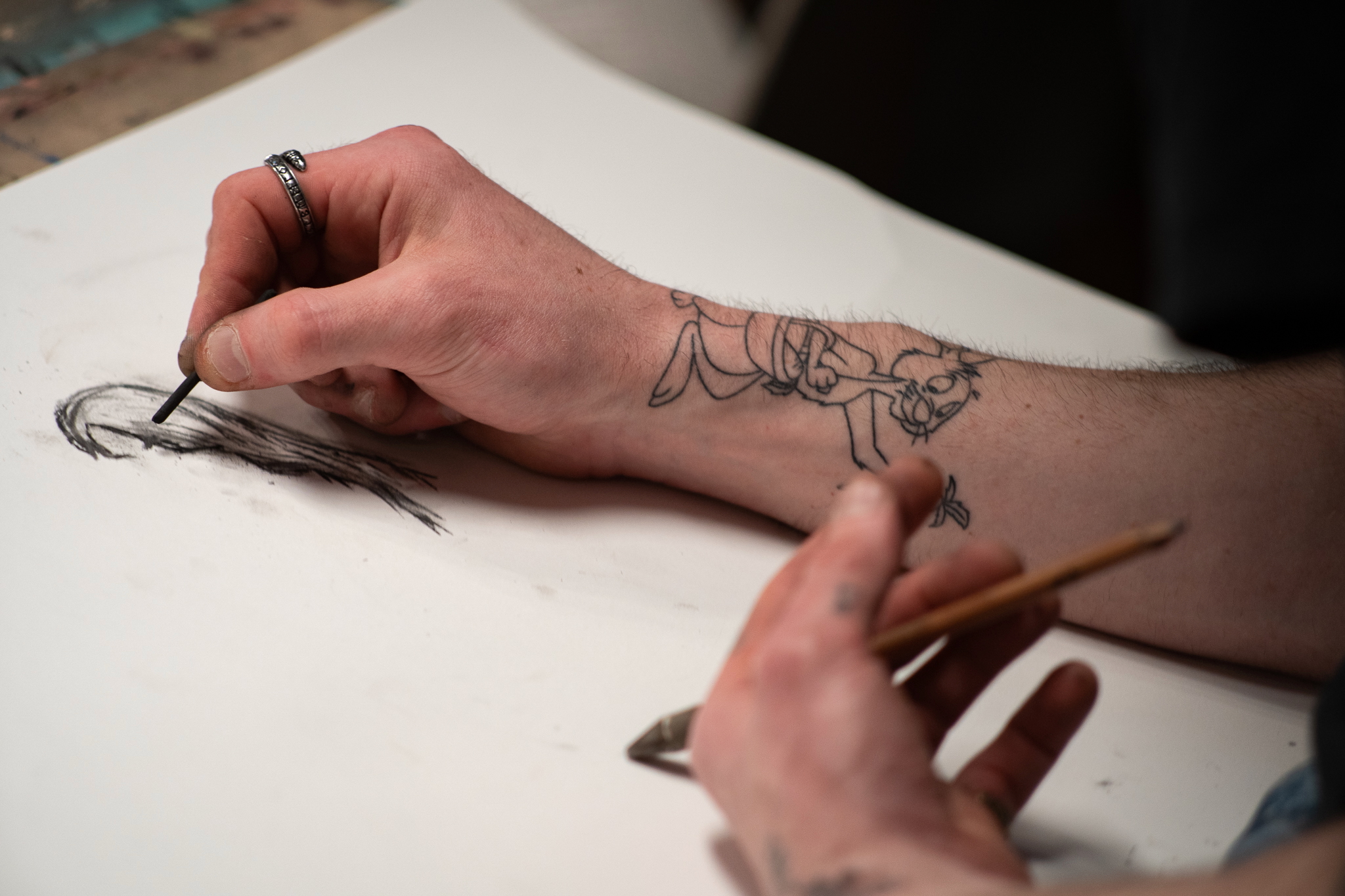 An artist sketching a model.