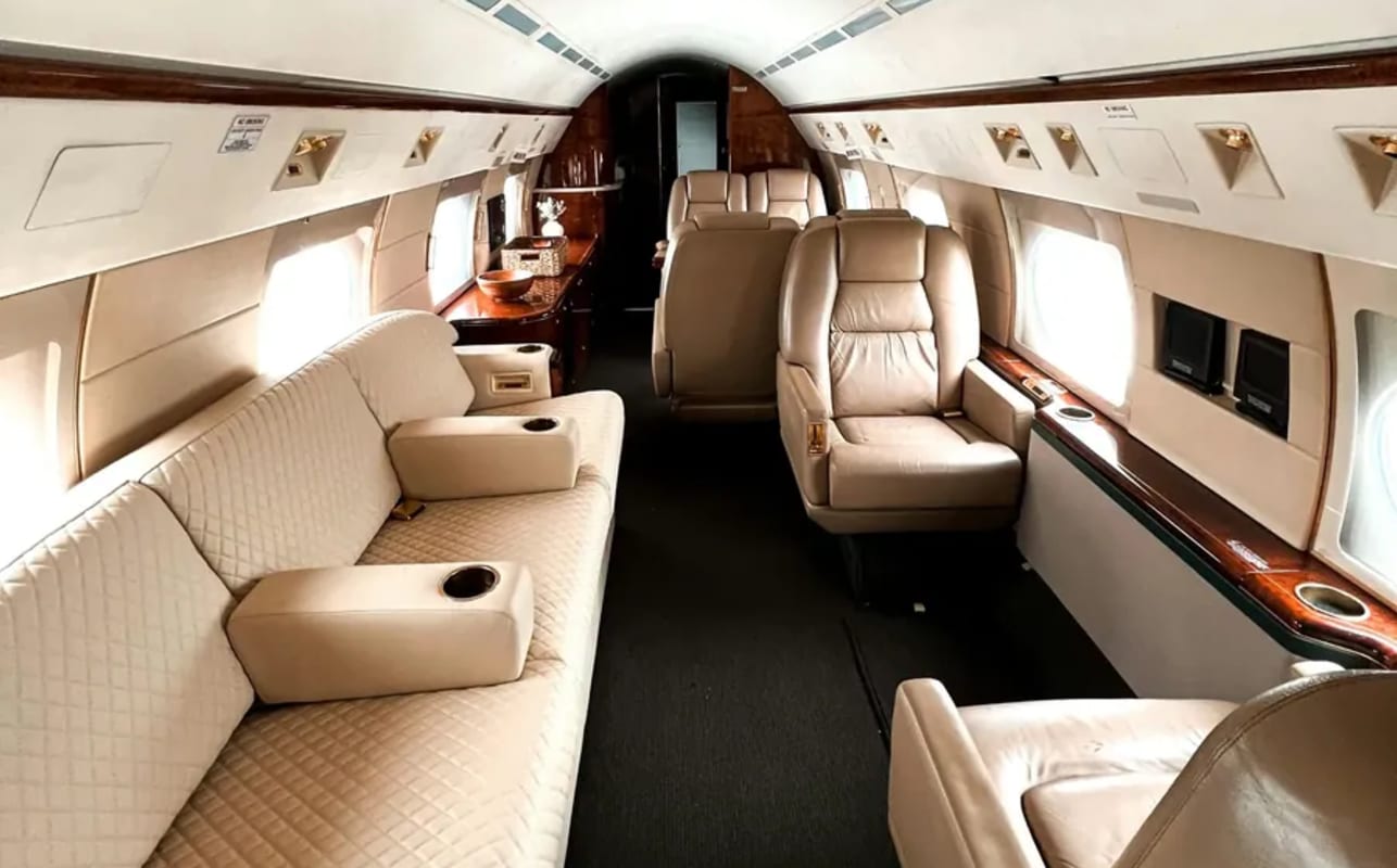 Private jet cabin interior with leather seating