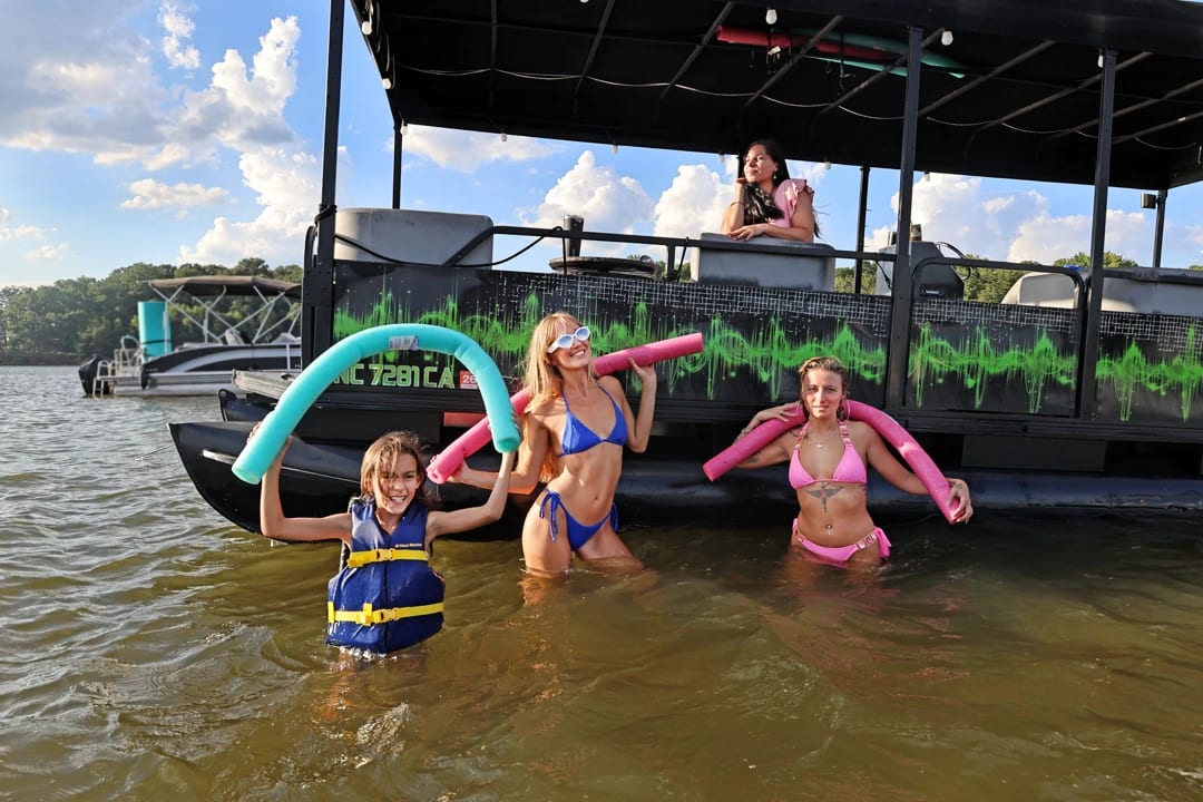 Guests swimming beside the pontoon