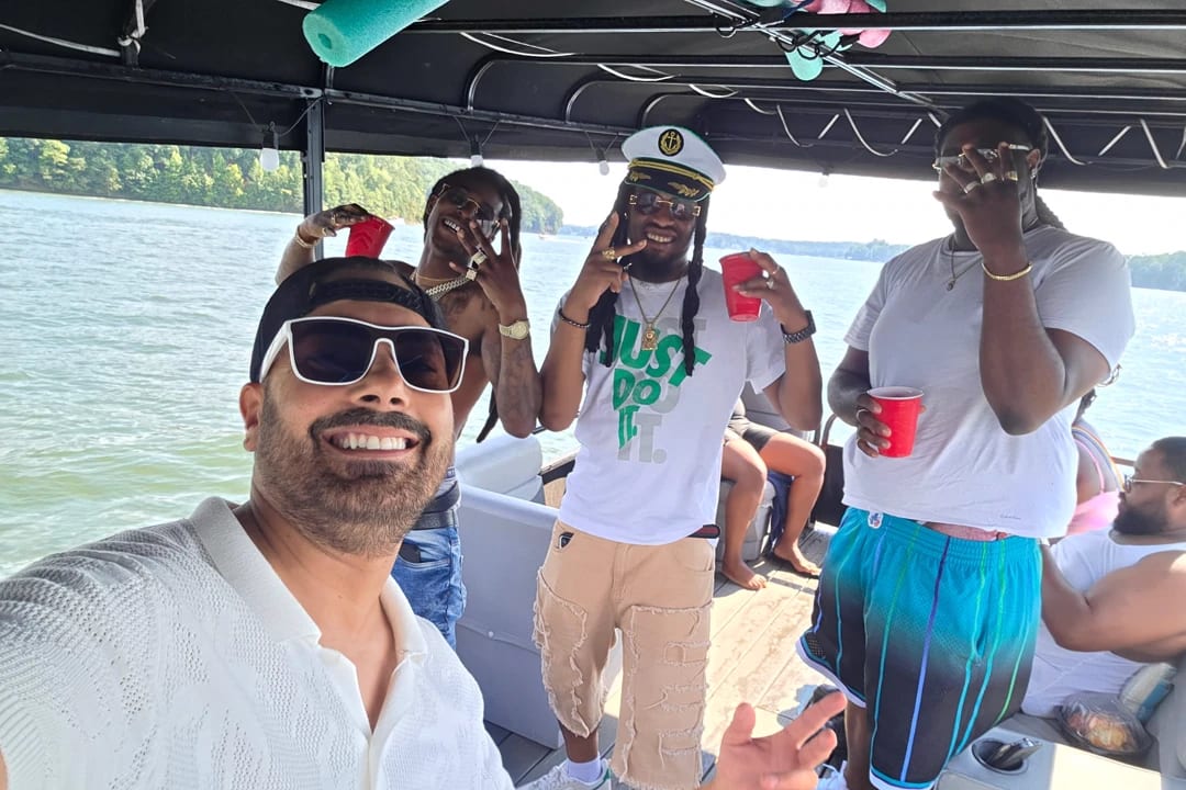 Friends toasting drinks on the party pontoon