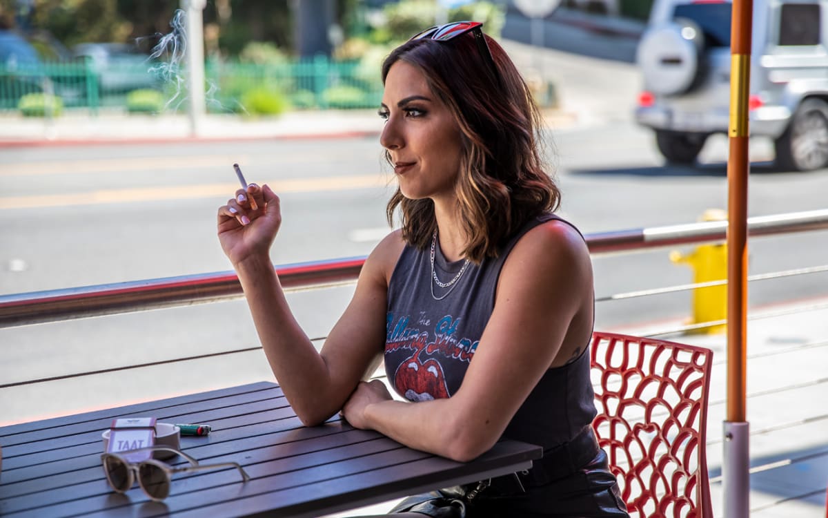 Woman enjoying a TAAT at an outdoor cafe table