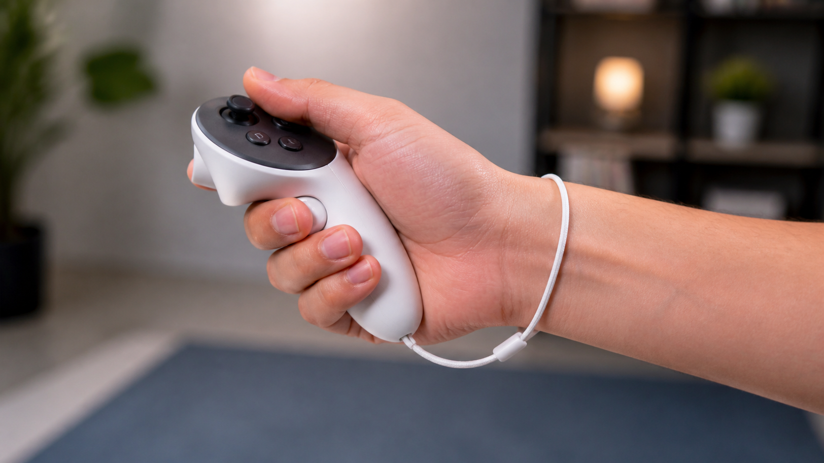 A close-up shot showing a relaxed hand holding a Meta Quest 3S controller with the wrist strap secured