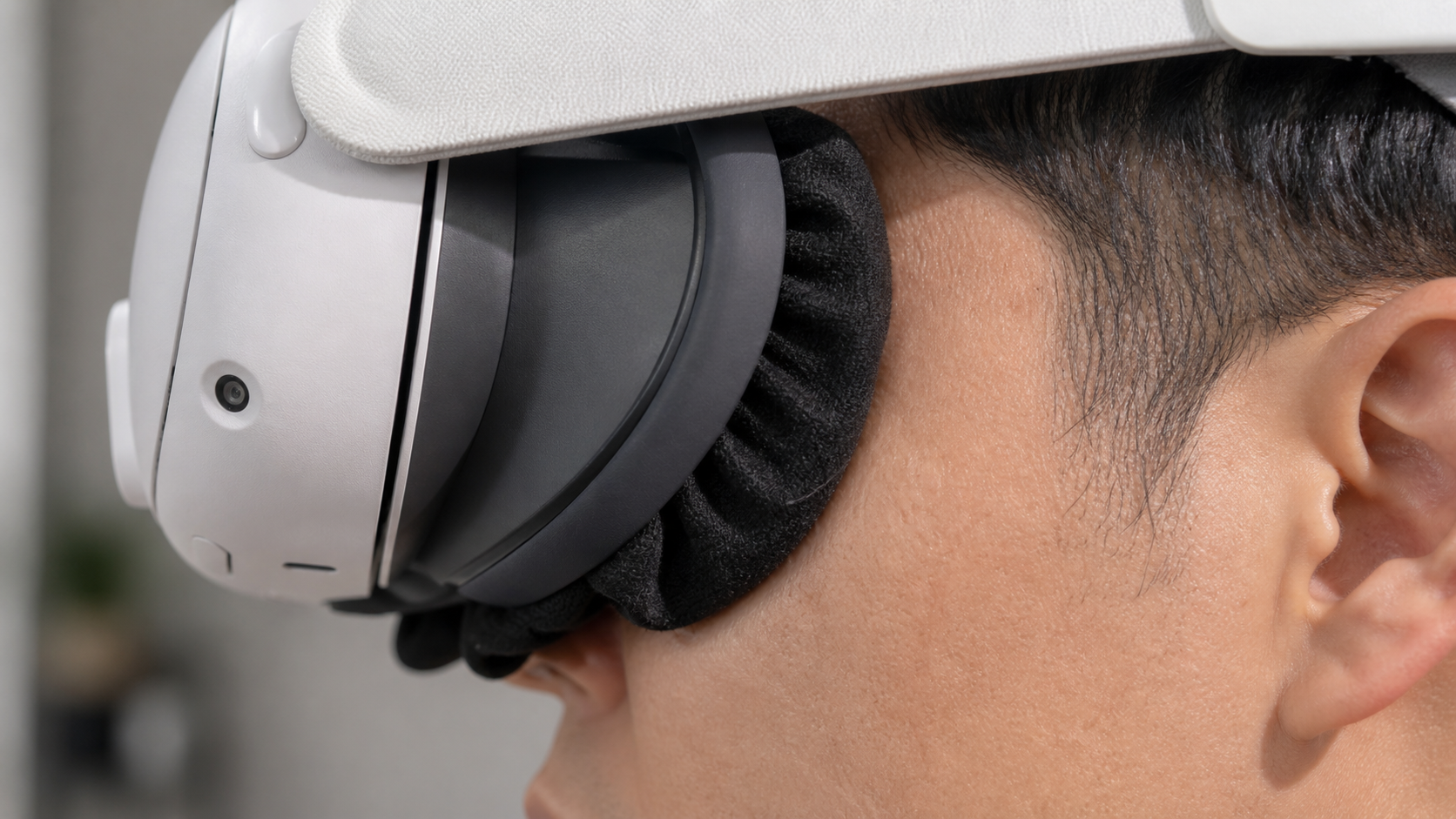 A close-up side view showing a sweat mask fitted between a person's face and the Quest 3 facial interface.